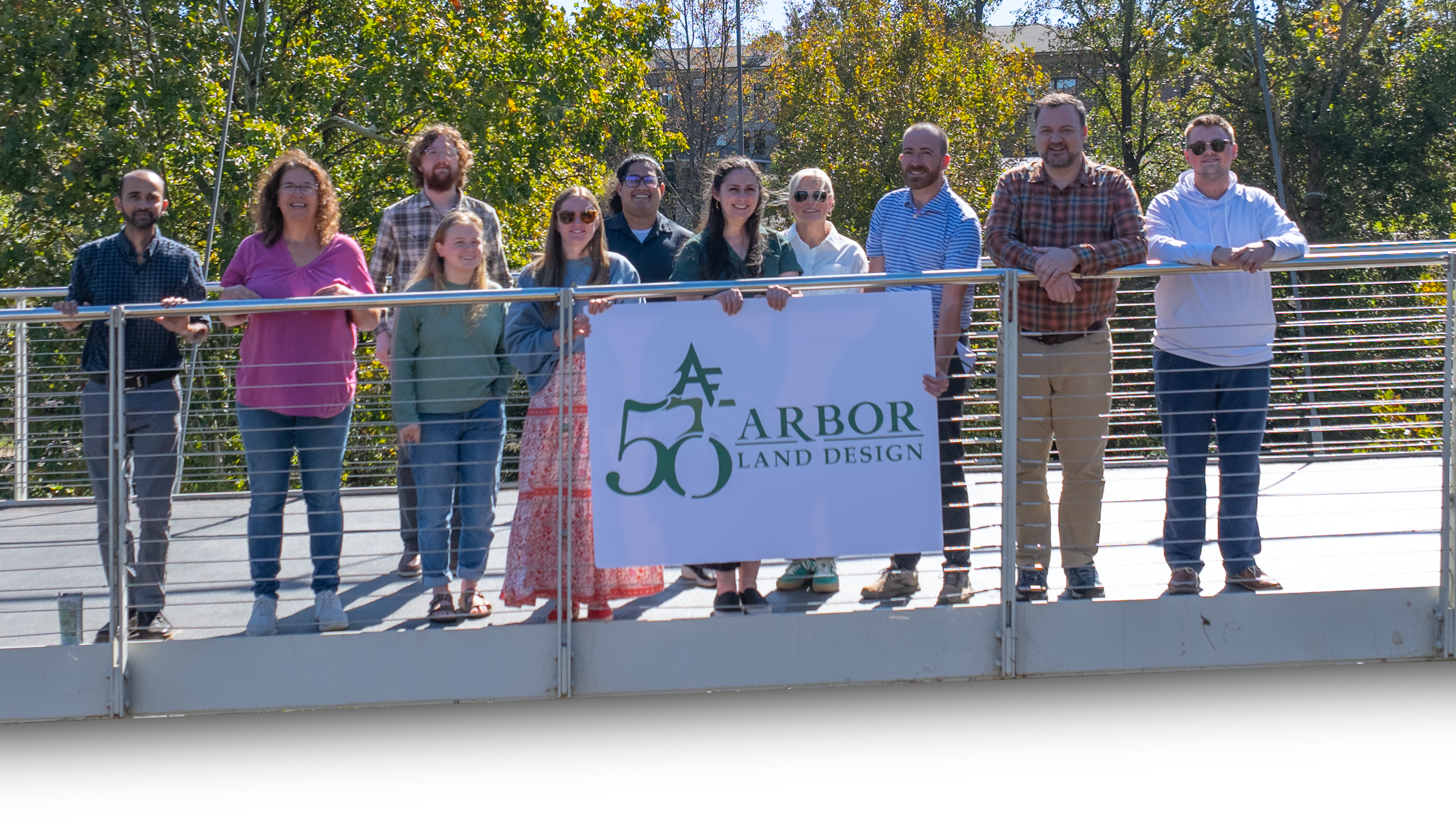 Arbor Land Design team gathered on a bridge in Greenville, South Carolina